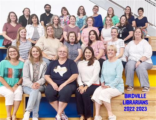 Group of librarians sitting on steps